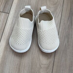 Beige slip on baby shoes